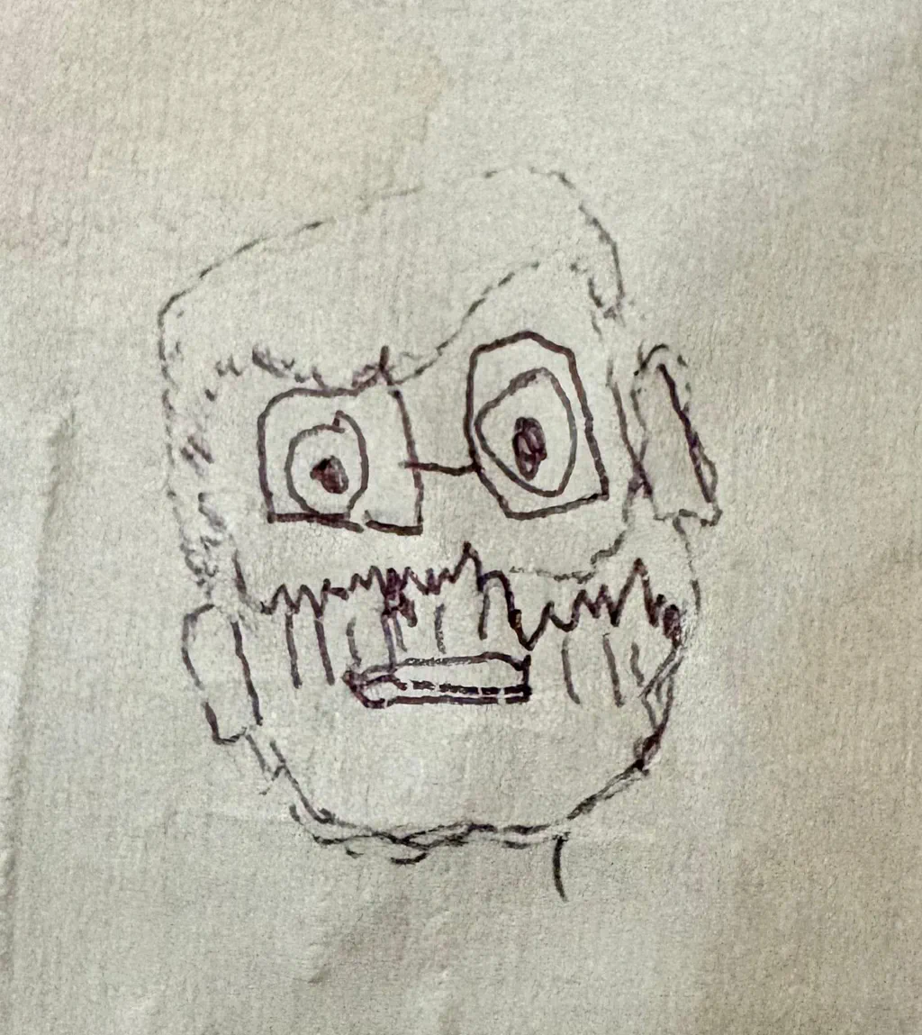 A drawing of Alessandro Mallamaci’s face in ballpoint pen on paper