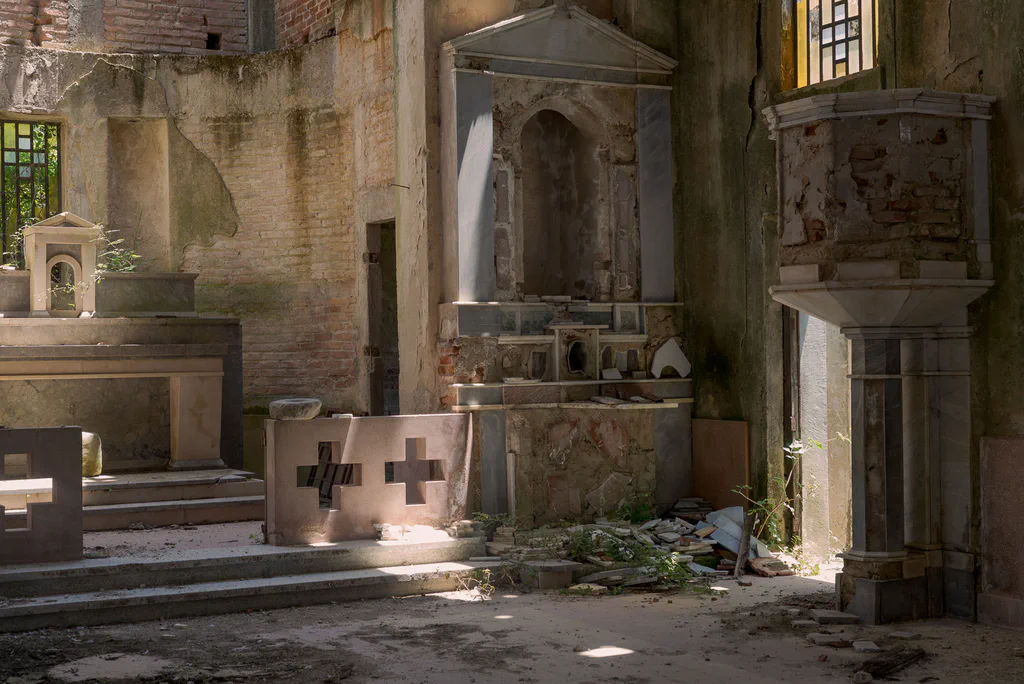 Interior of an abandoned church, altars and crosses in the half-light