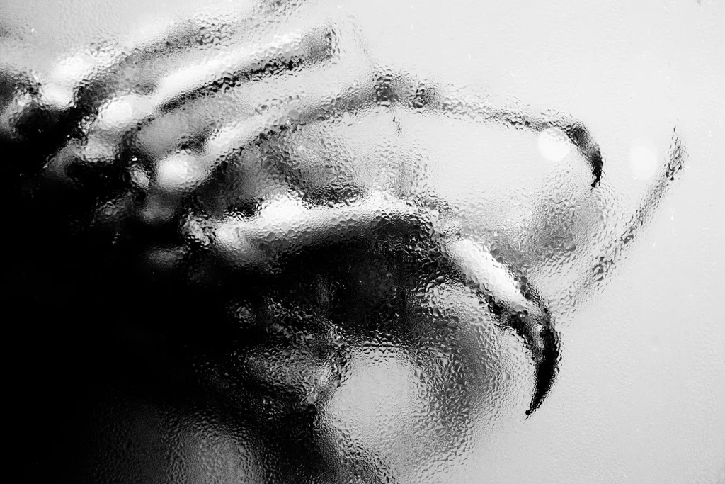 Water running down a pane of glass