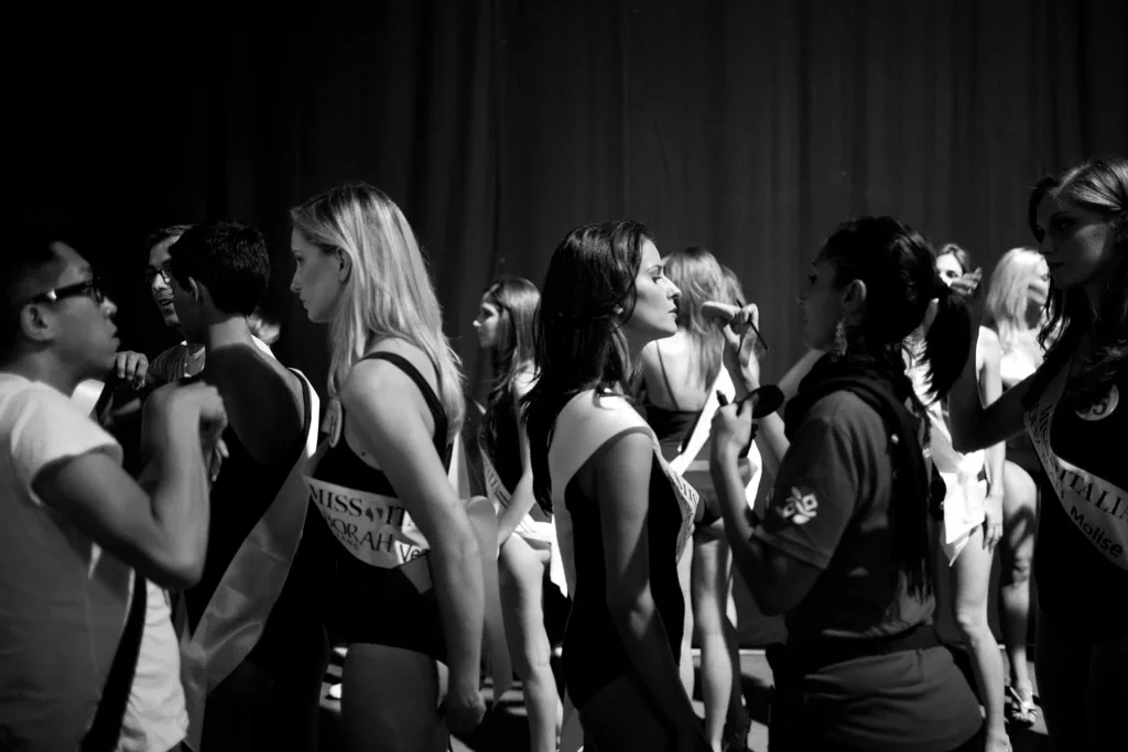 Contestants crowded together in sashes before going on stage