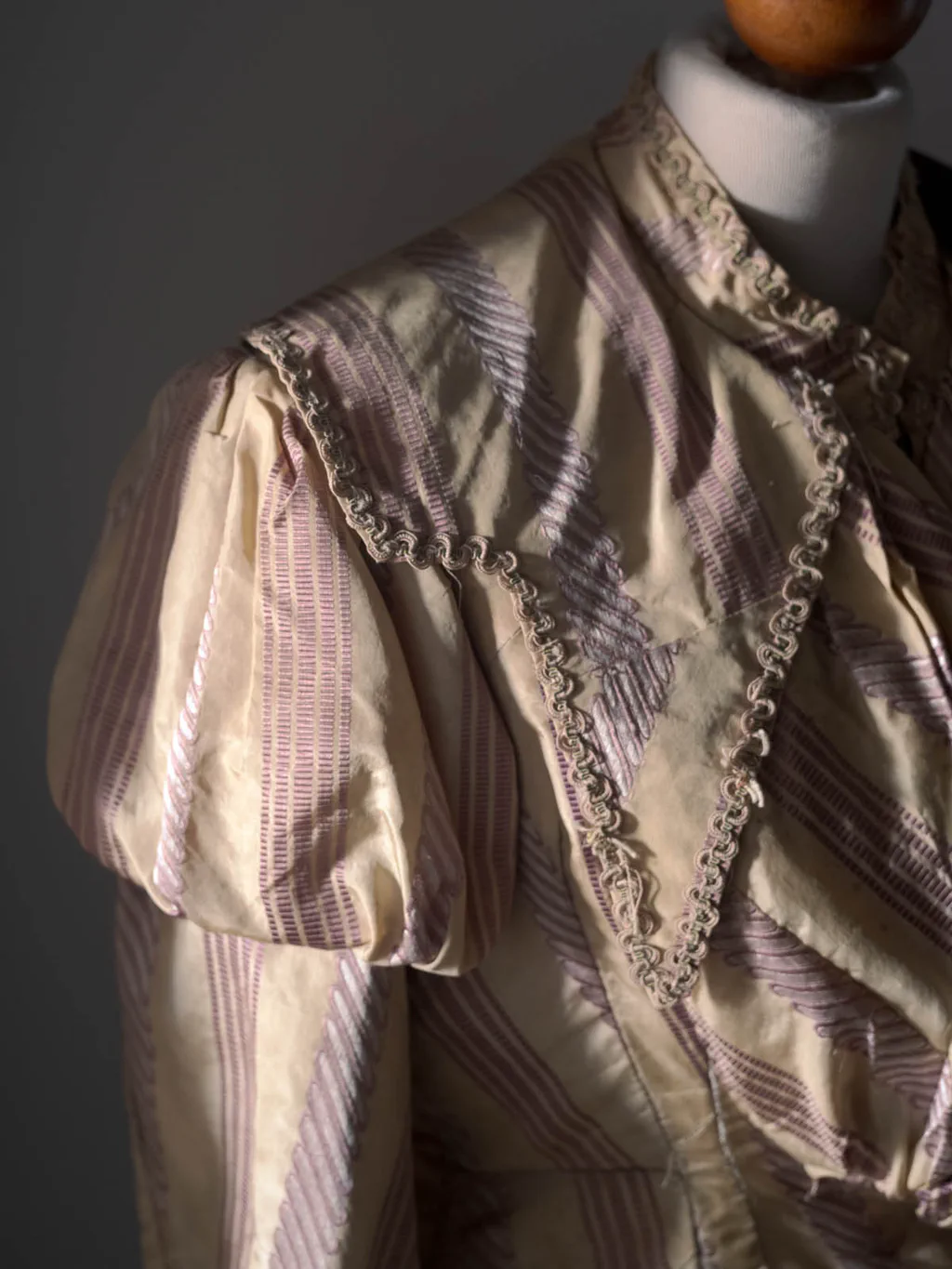 Striped silk blouse of the early twentieth century on a dressmaker’s dummy