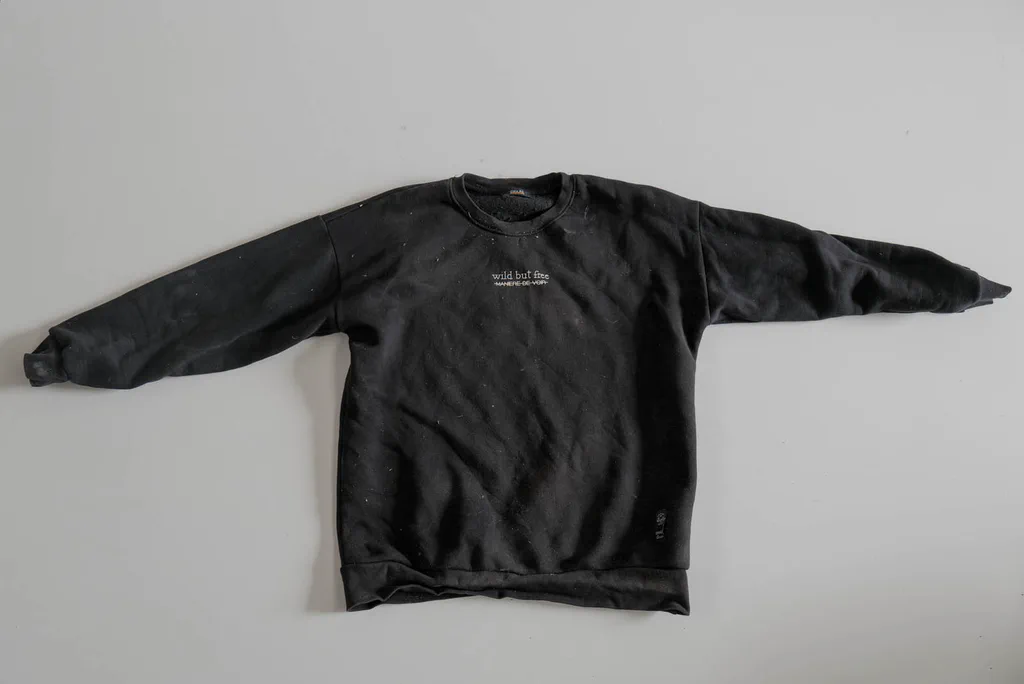 Black sweatshirt, sleeves spread out
