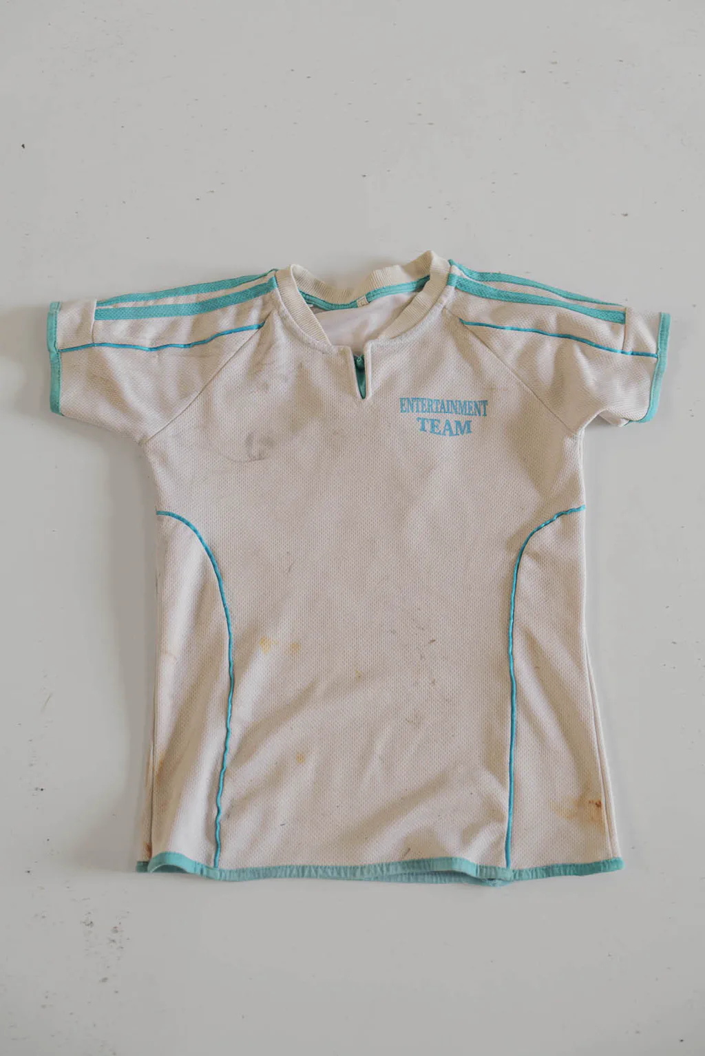 White sports shirt with turquoise trim
