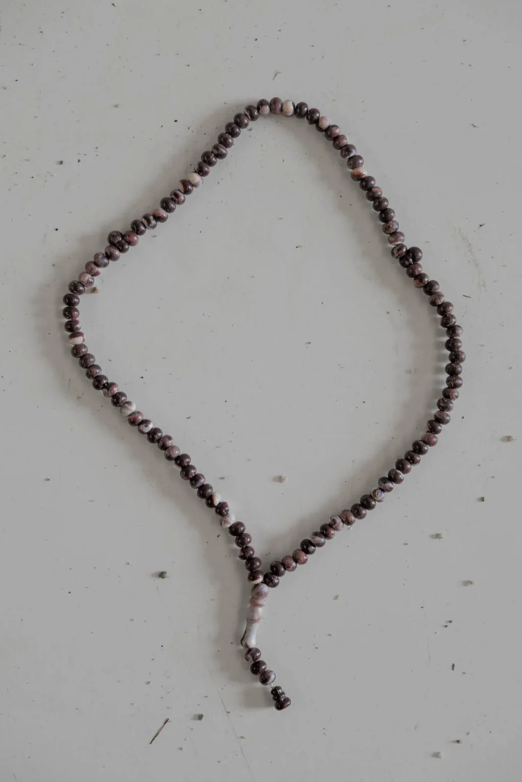 Beaded necklace laid out in a loop