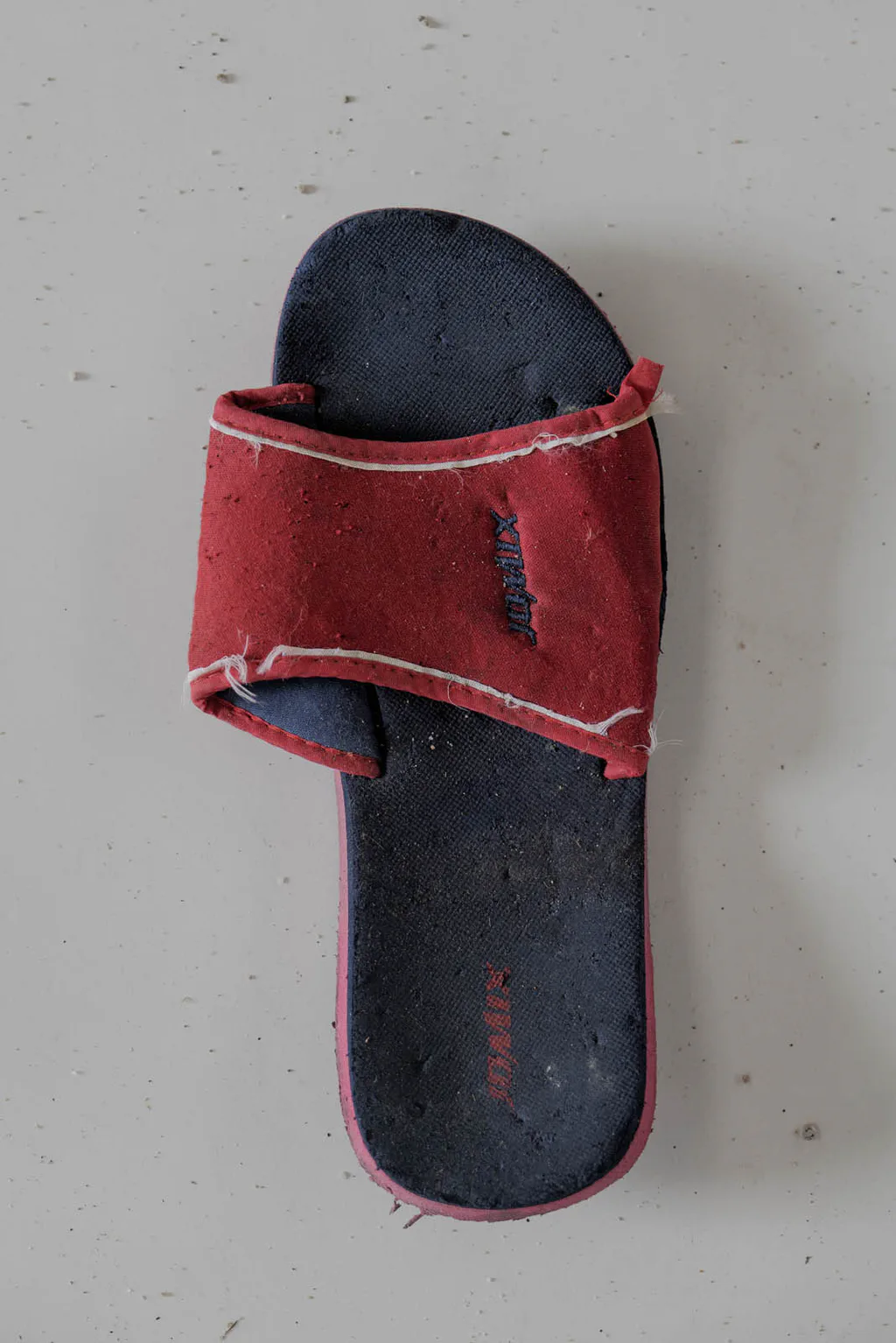Slide sandal with a red strap