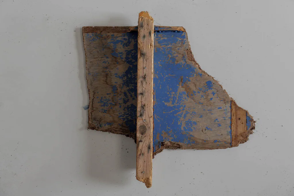 Painted fragment of a wooden boat, blue and ochre