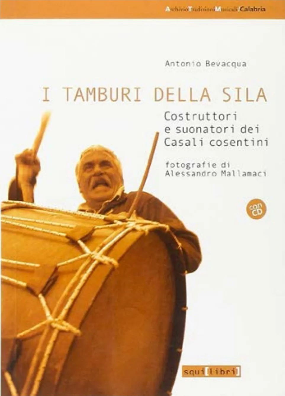 The cover of I tamburi della Sila: a man playing a large frame drum
