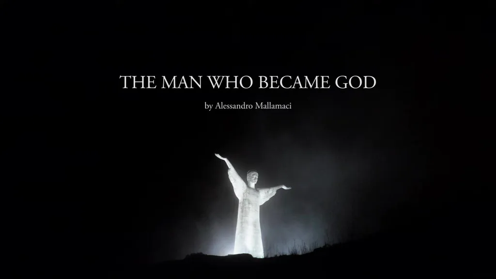 The statue of Christ at Maratea at night, lit in the fog, arms open; the title of the film above it